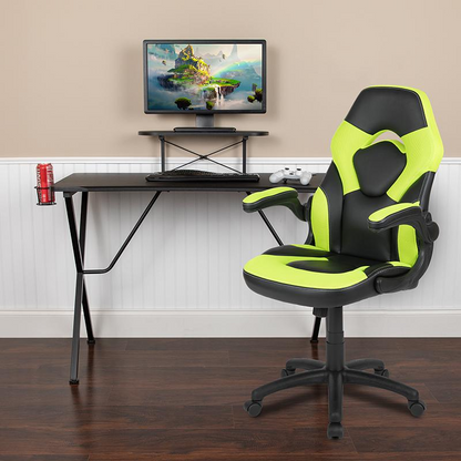 Start2Finish black gaming desk with green and black racing chair set, featuring sleek design and ergonomic gaming setup.