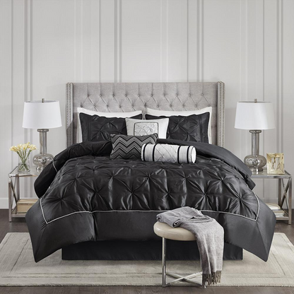 Black Laurel 7-piece tufted comforter set by Start2Finish, showing the textured comforter, matching pillow shams, and decorative accents.