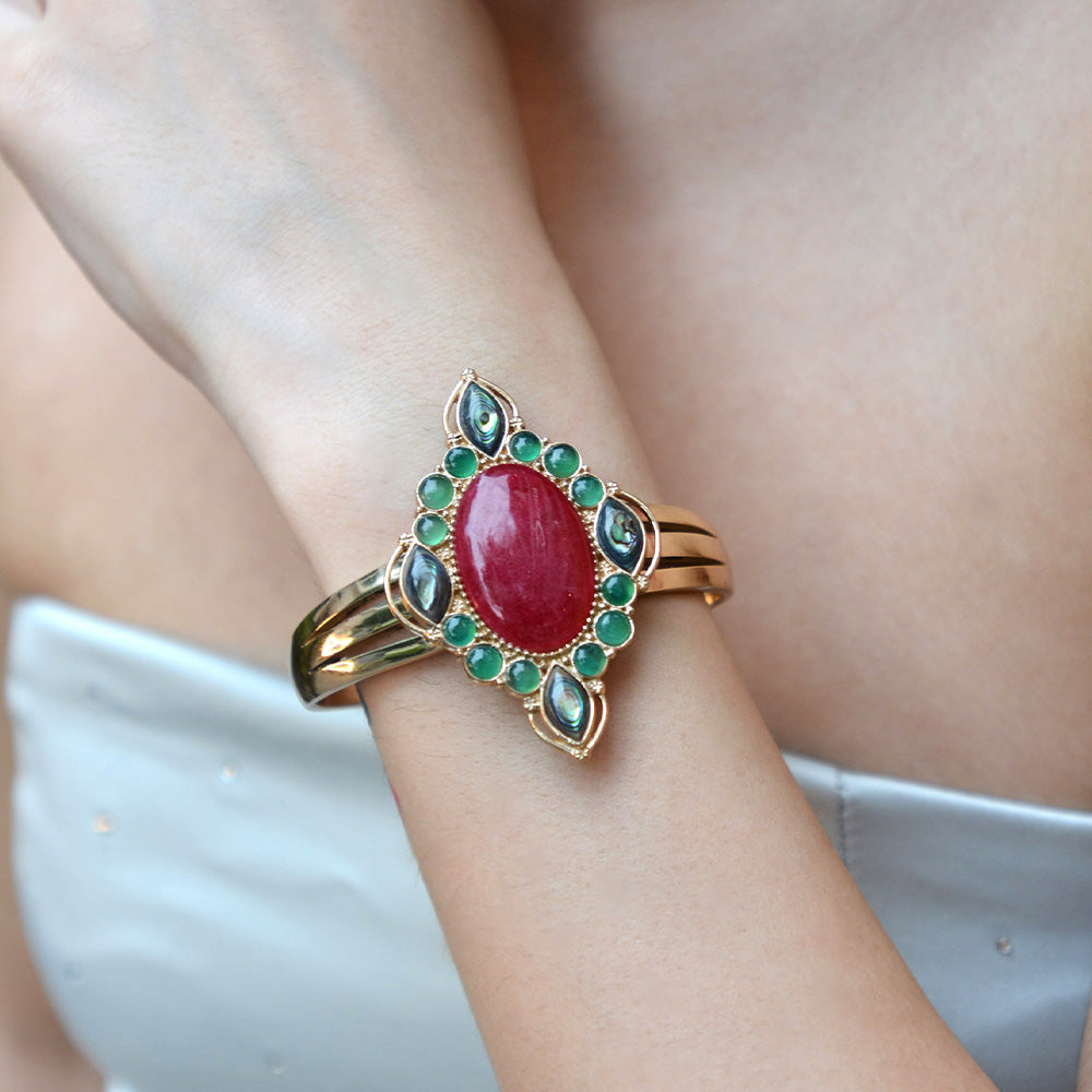 Regalia Red Onyx Golden Cuff Bracelet by Start2Finish, showcasing a bold red onyx stone with gold accents and intricate design details.