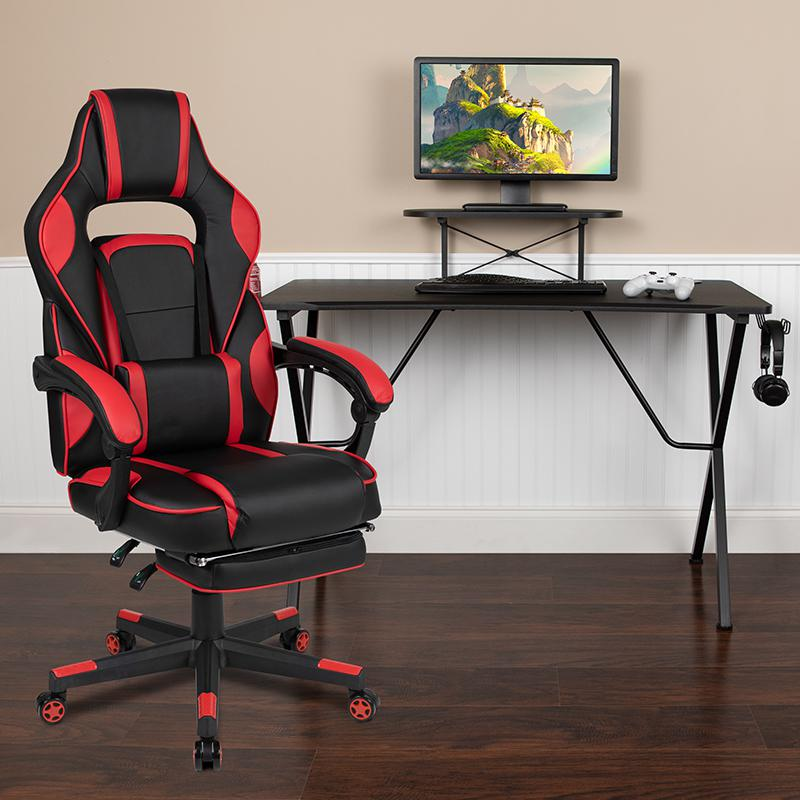 Start2Finish black gaming desk with headphone hook, monitor stand, red back, and adjustable arms gaming chair in a modern setup