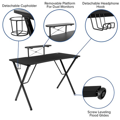 Black gaming desk with a gray and black racing chair, ergonomic furniture set by Start2Finish for gaming and work setups.
