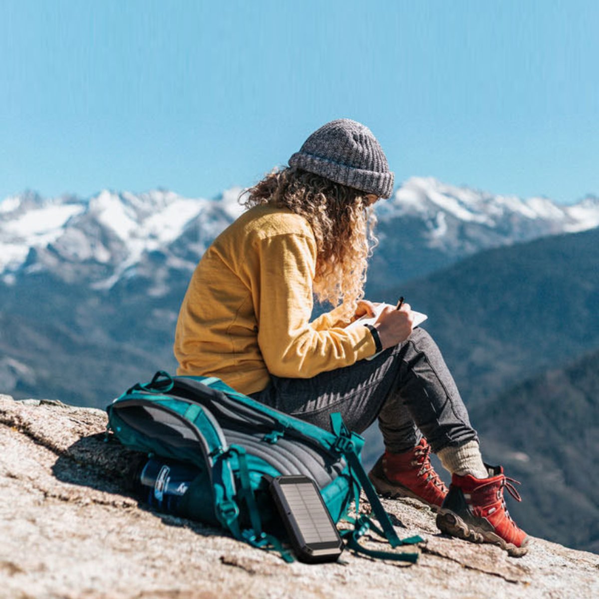 Salmon Lucky Sun Chaser mini solar-powered wireless phone charger with 10,000mAh capacity and portable tech accessory design.