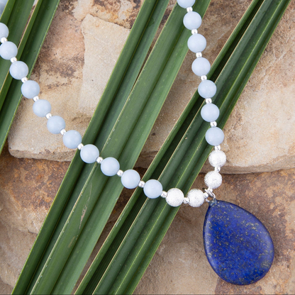Denim blue angelite and lapis pendant silver necklace with detailed gemstone beads and elegant chain design.