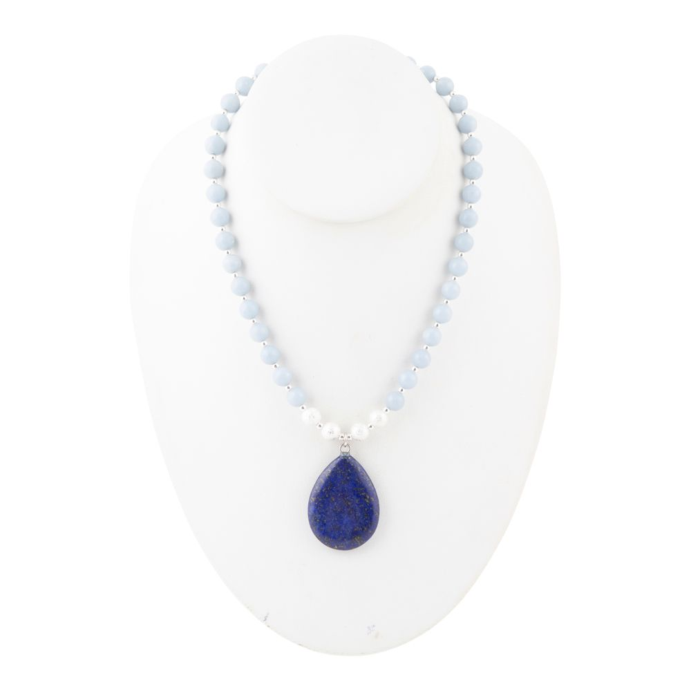 Denim blue angelite and lapis pendant silver necklace with intricate bead details, worn on a model&