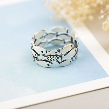 Silver fish ring by Fuchsia Molly featuring a sleek, detailed fish design, perfect for stylish jewelry collection.
