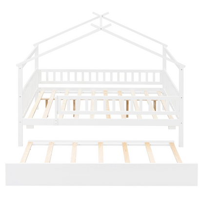 Wooden house-style bed frame with pull-out trundle drawer and slatted support, by Start2Finish, shown in a cozy bedroom setting.