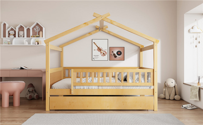 Wooden house-style bed frame with pull-out trundle drawer and slatted support by Start2Finish, shown in a cozy bedroom setting.