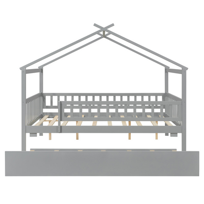 Wooden house-style bed frame with pull-out trundle drawer and slatted support by Start2Finish, shown in a cozy bedroom setting.