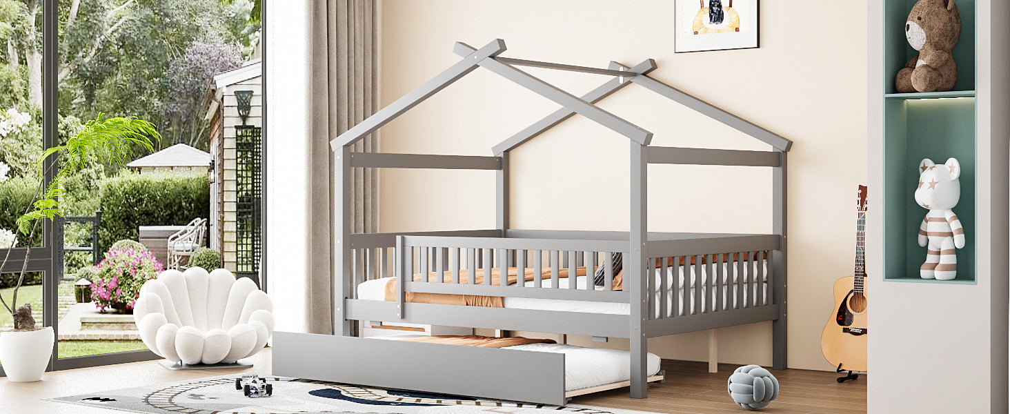Wooden house-style bed frame with pull-out trundle drawer and slatted support, by Start2Finish, shown with mattress and bedding.