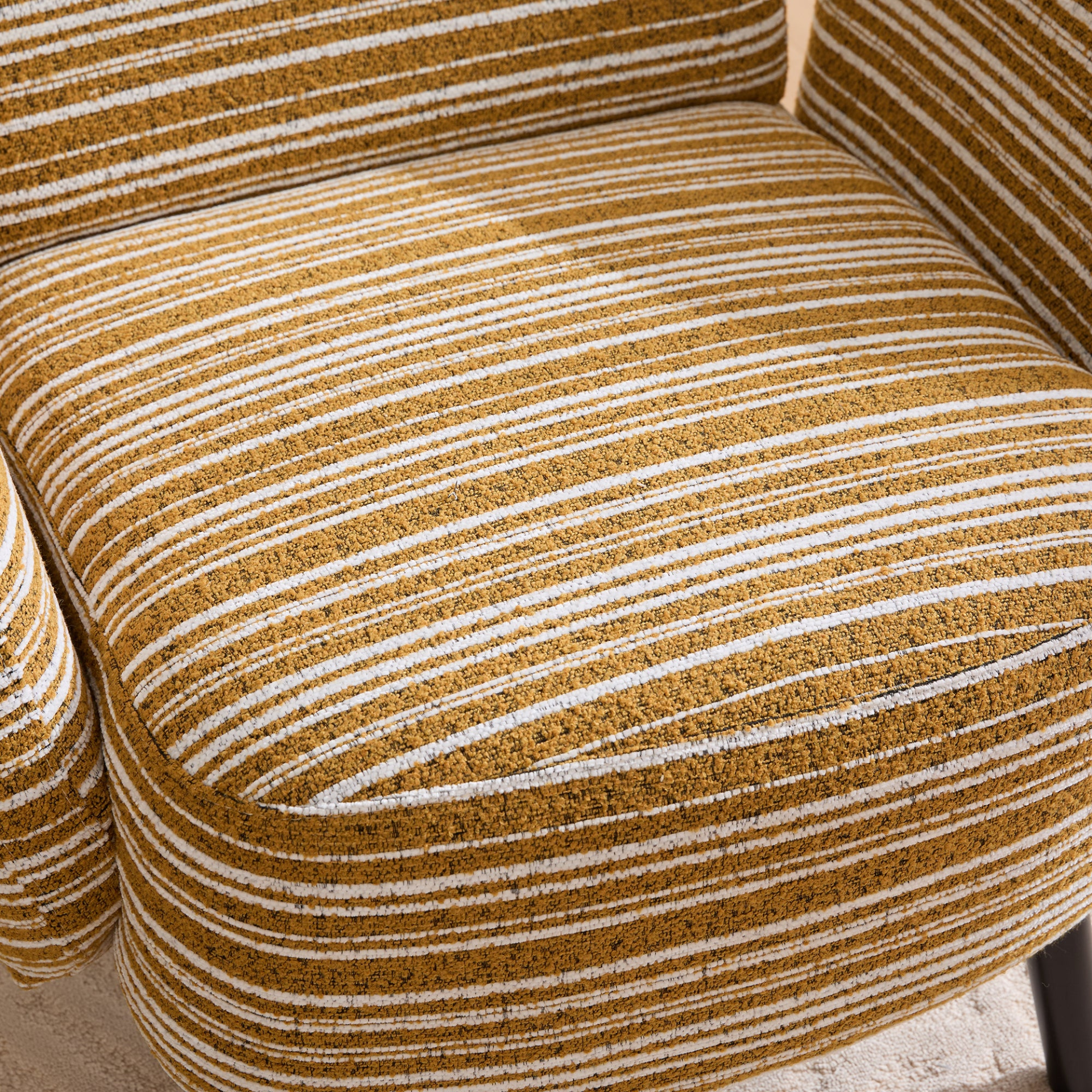 Modern armchair by Start2Finish with sanded fabric, solid wood legs, and a side storage pocket for stylish comfort.