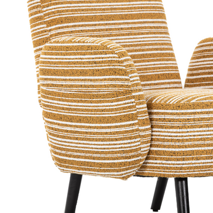 Modern armchair by Start2Finish with sanded fabric, side storage pocket, and solid wood legs, shown in a cozy living room setting.