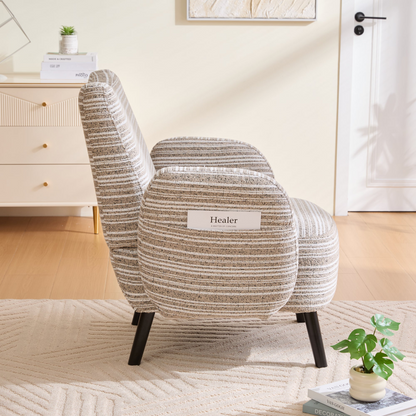 Modern armchair with sanded fabric, side storage pocket, and solid wood legs by Start2Finish, shown in a cozy living room setting.