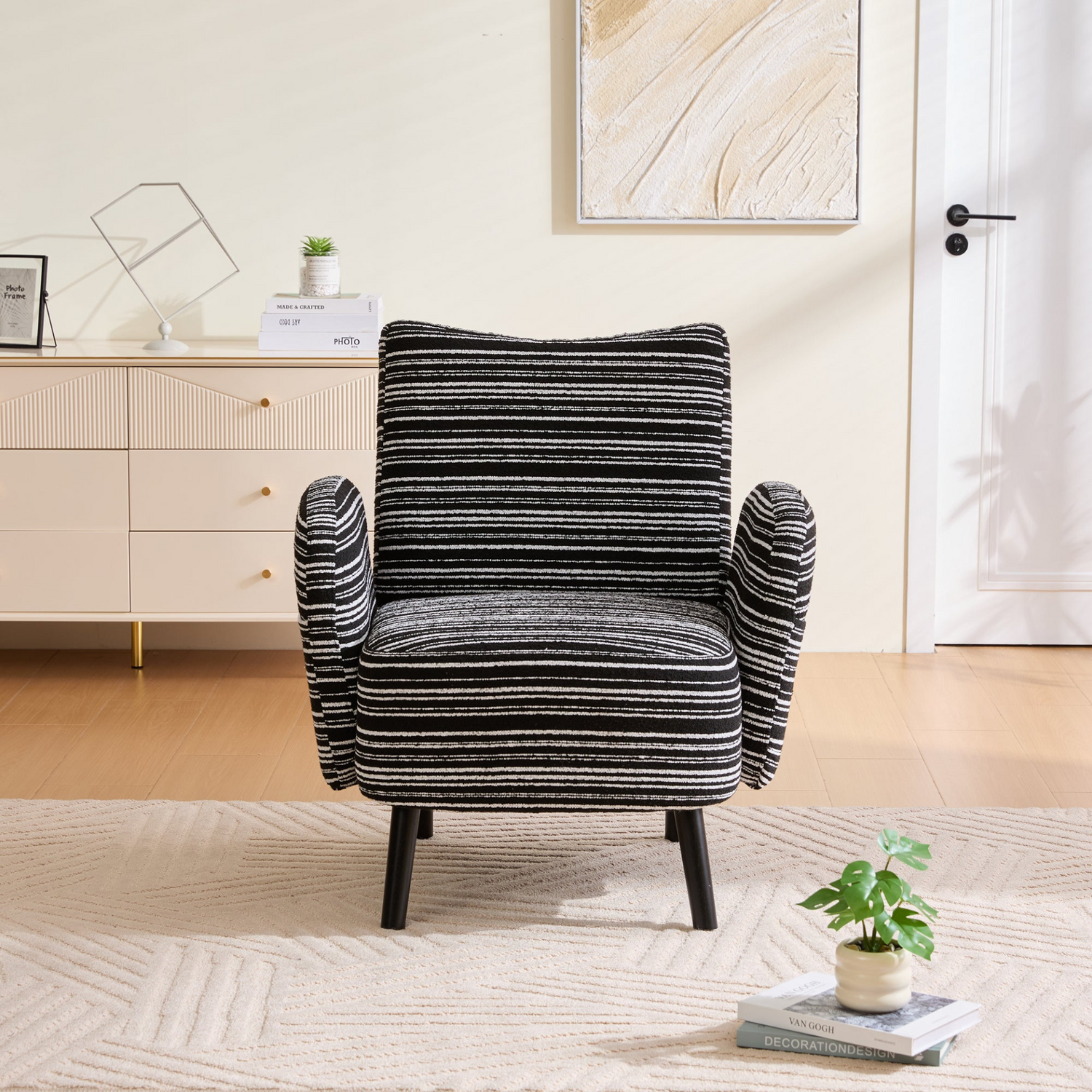 Modern armchair by Start2Finish with sanded fabric, side storage pocket, and solid wood legs, shown in a living room setting.