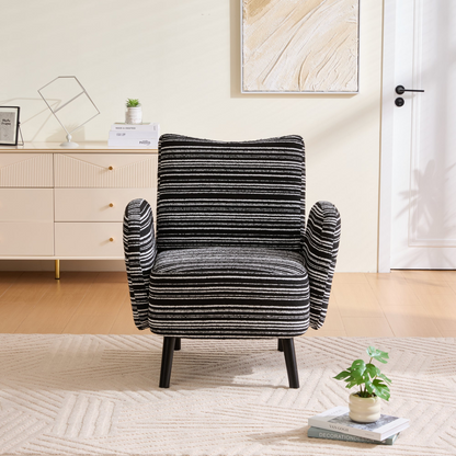 Modern armchair by Start2Finish with sanded fabric, side storage pocket, and solid wood legs, shown in a living room setting.
