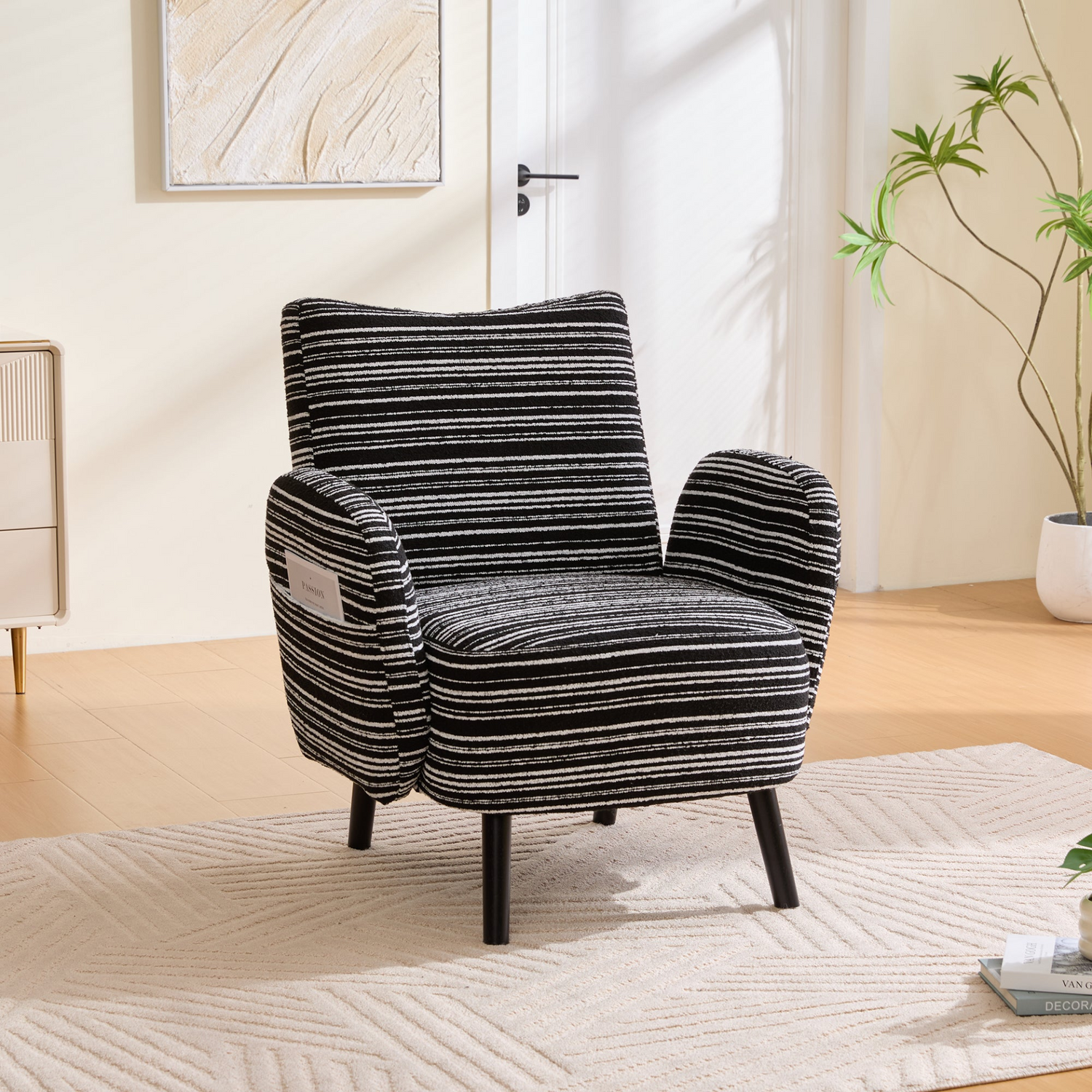 Modern armchair with sanded fabric upholstery, side storage pocket, and solid wood legs from Start2Finish.