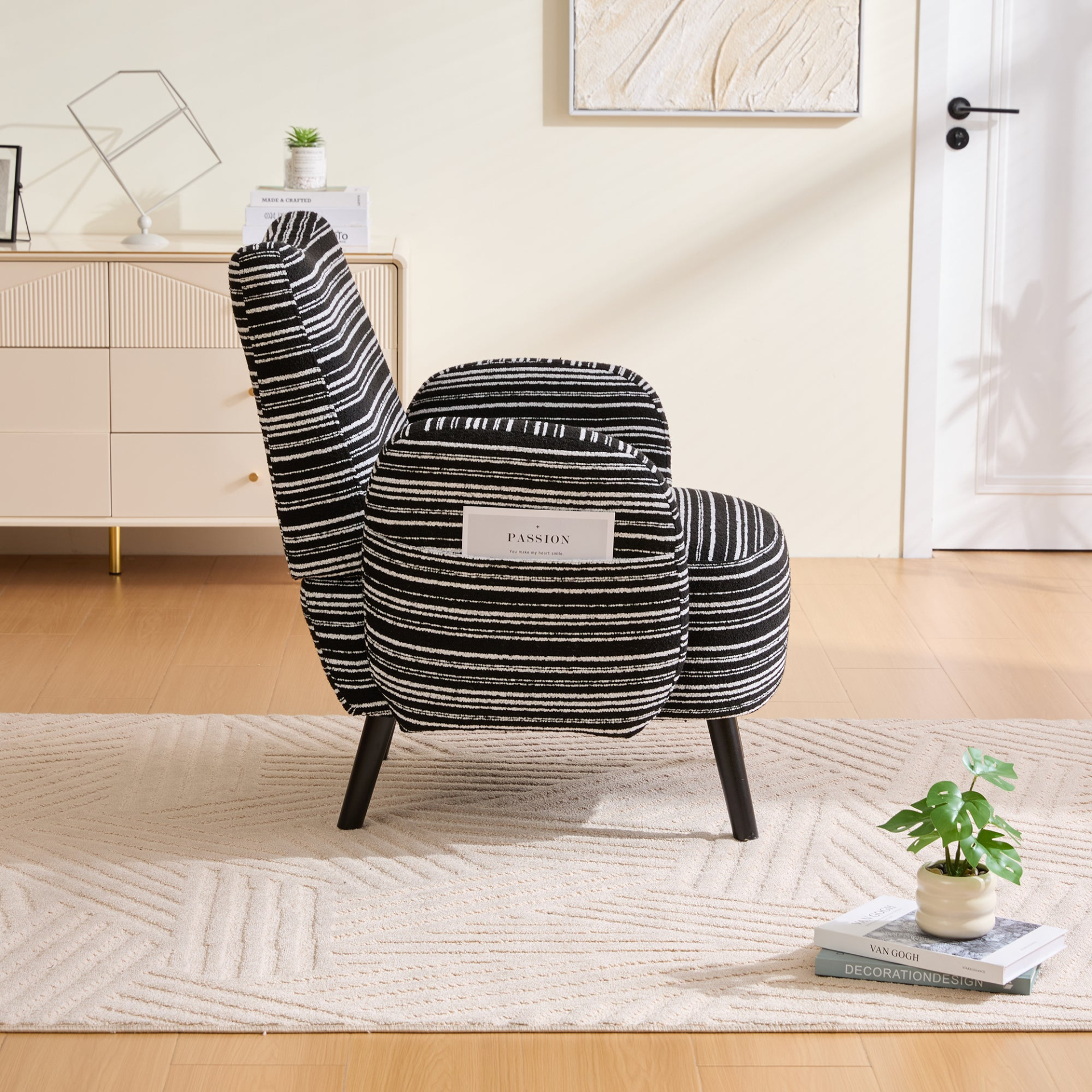 Modern armchair with sanded fabric, solid wood legs, and a side storage pocket from Start2Finish.