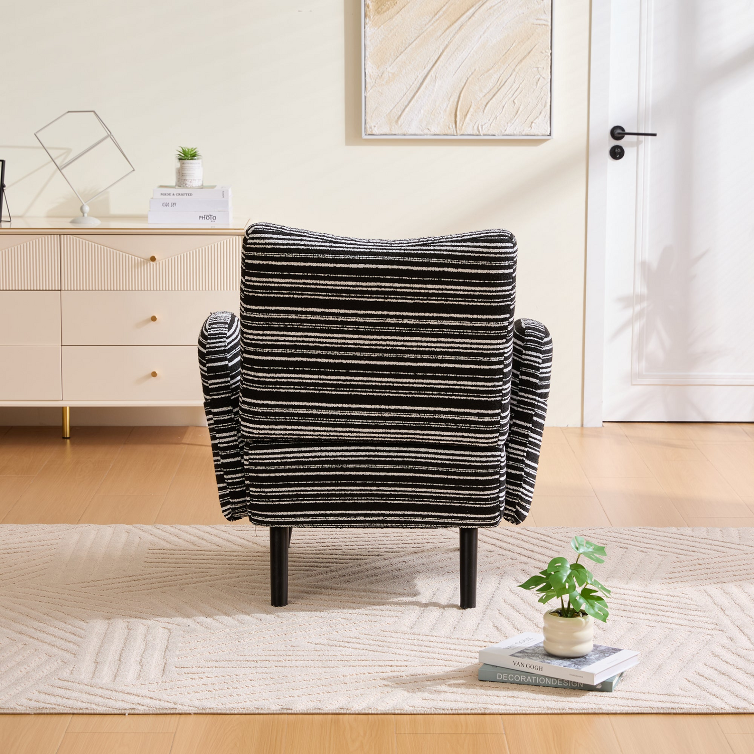 Modern armchair by Start2Finish featuring sanded fabric, solid wood legs, and a side storage pocket for stylish comfort.