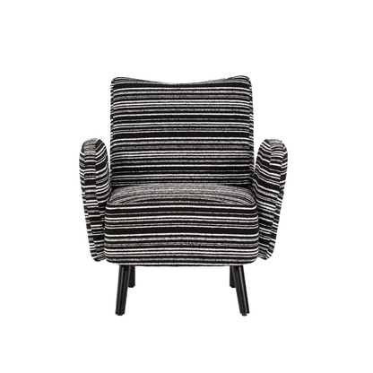 Modern armchair with sanded fabric, solid wood legs, and side storage pocket by Start2Finish, shown with a cozy sitting area.