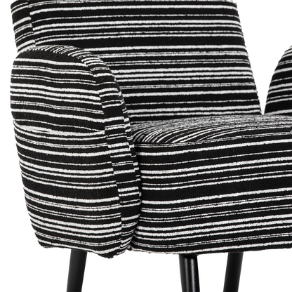 Modern armchair with sanded fabric, solid wood legs, and side storage pocket by Start2Finish, shown with plush cushioning and stylish design.