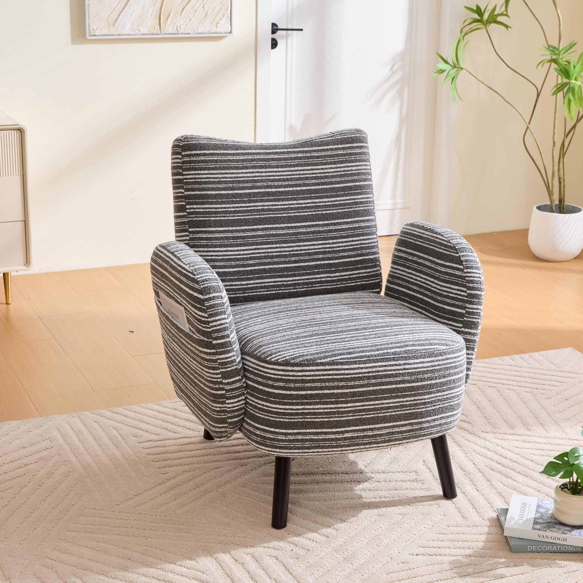 Modern armchair with sanded fabric, solid wood legs, and side storage pocket, showcasing its stylish and functional design.
