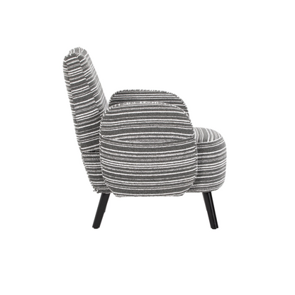 Modern armchair by Start2Finish with sanded fabric, solid wood legs, and a side storage pocket, shown in a cozy living room setting.
