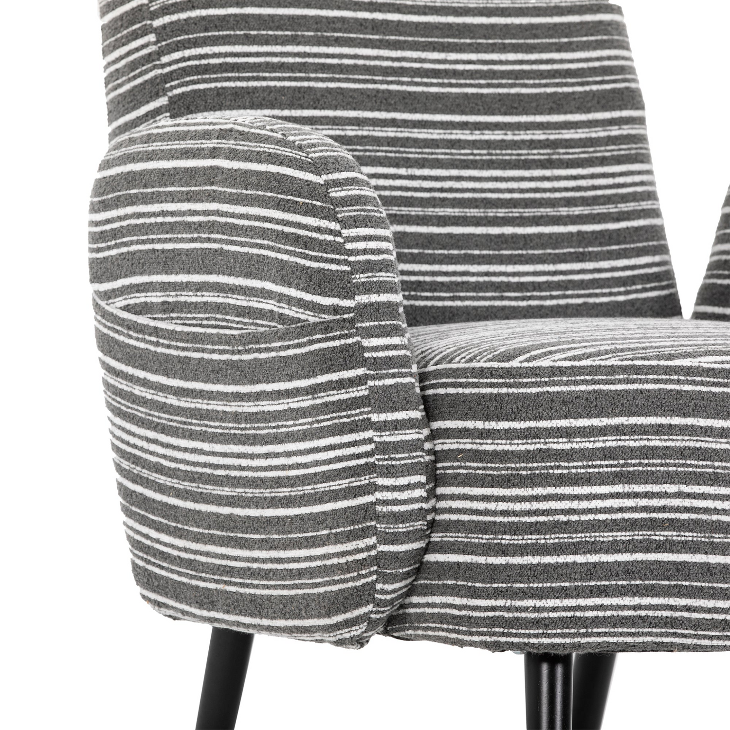 Modern armchair by Start2Finish with sanded fabric, side storage pocket, and solid wood legs in a stylish living room setting.