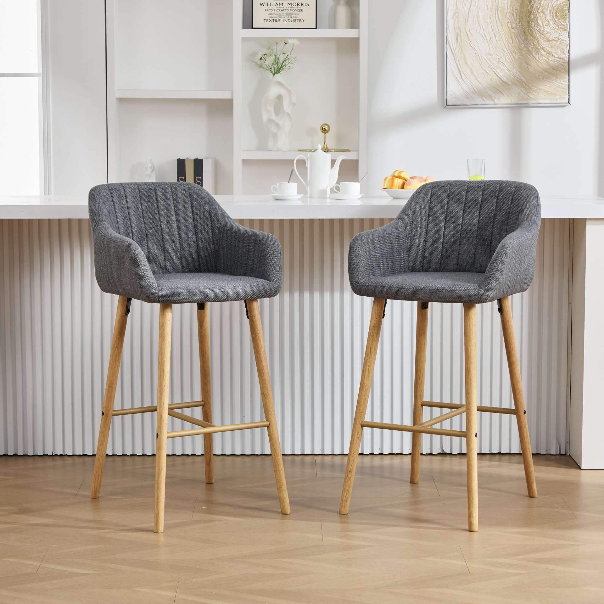 Modern linen upholstered bar stool with back, armrests, footrest, and solid wood legs from Start2Finish furniture.