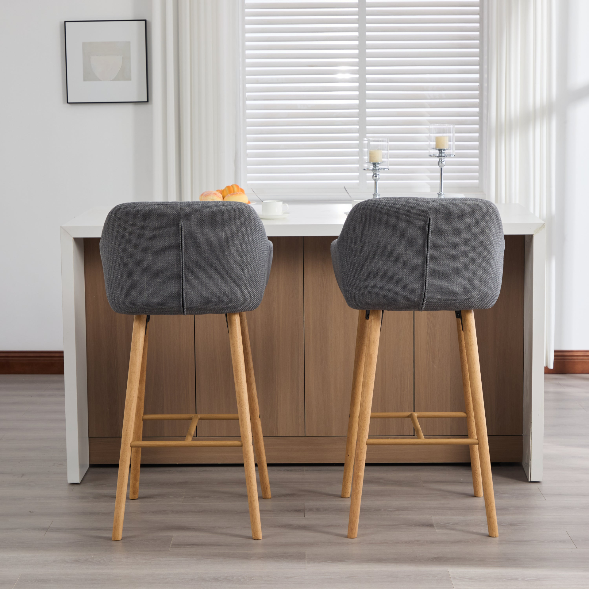 Modern linen upholstered bar stool with back, armrests, footrest, and solid wood legs from Start2Finish, designed for stylish seating.