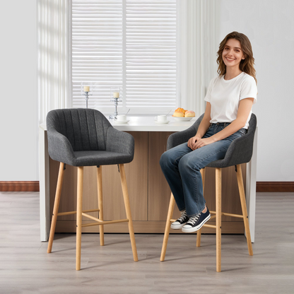 Modern linen upholstered bar stool with back, armrests, footrest, and solid wood legs from Start2Finish furniture.