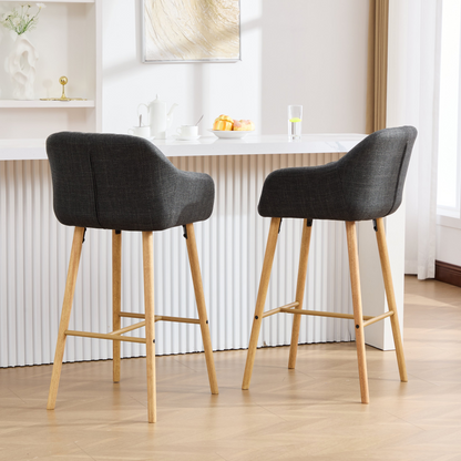 Modern linen upholstered bar stool with backrest, armrests, footrest, and solid wood legs from Start2Finish furniture.