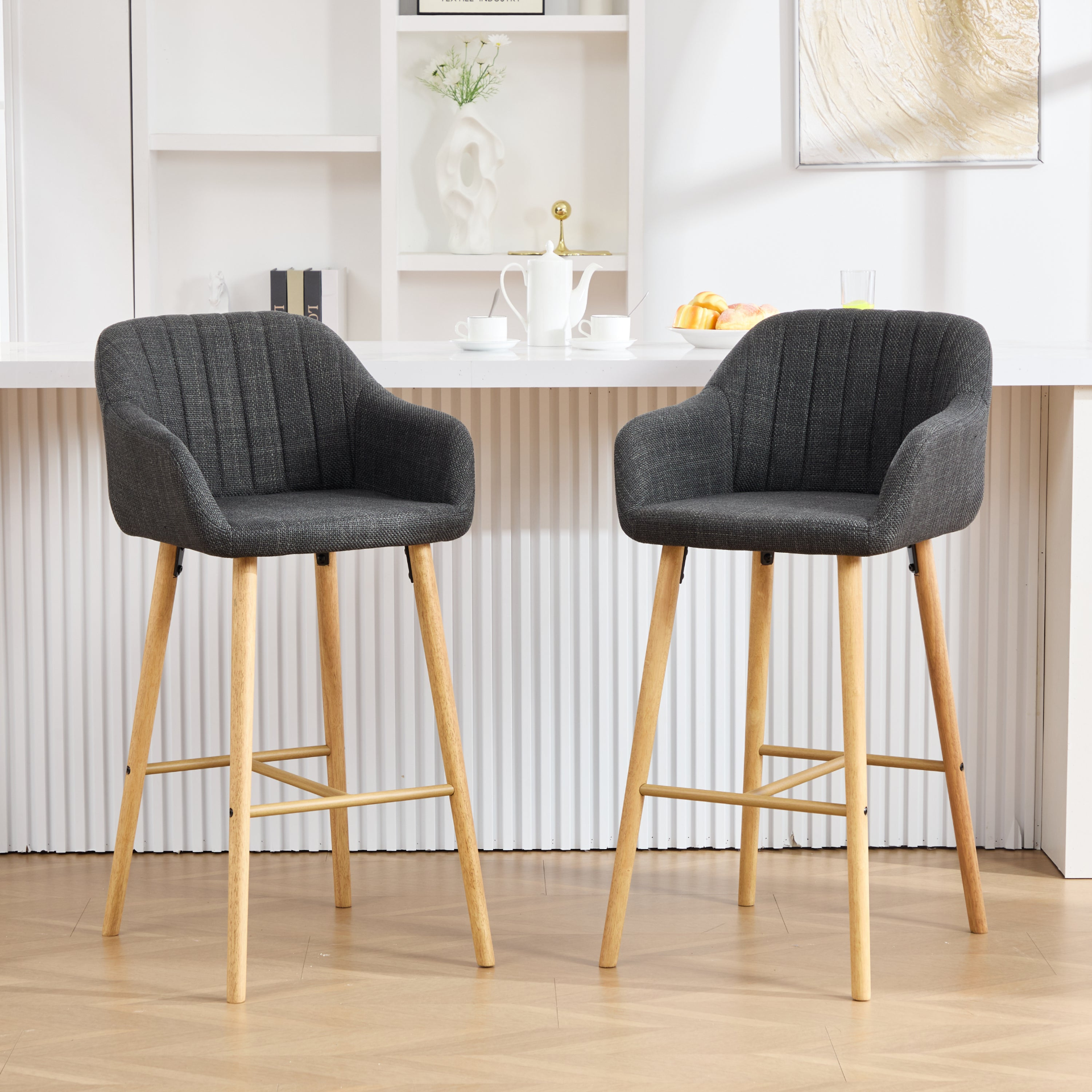 Modern linen upholstered bar stool with back, armrests, footrest, and solid wood legs from Start2Finish furniture.