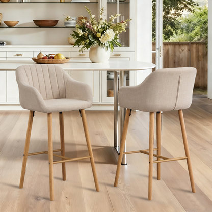 Modern linen upholstered bar stool with back, armrests, footrest, and solid wood legs from Start2Finish furniture.