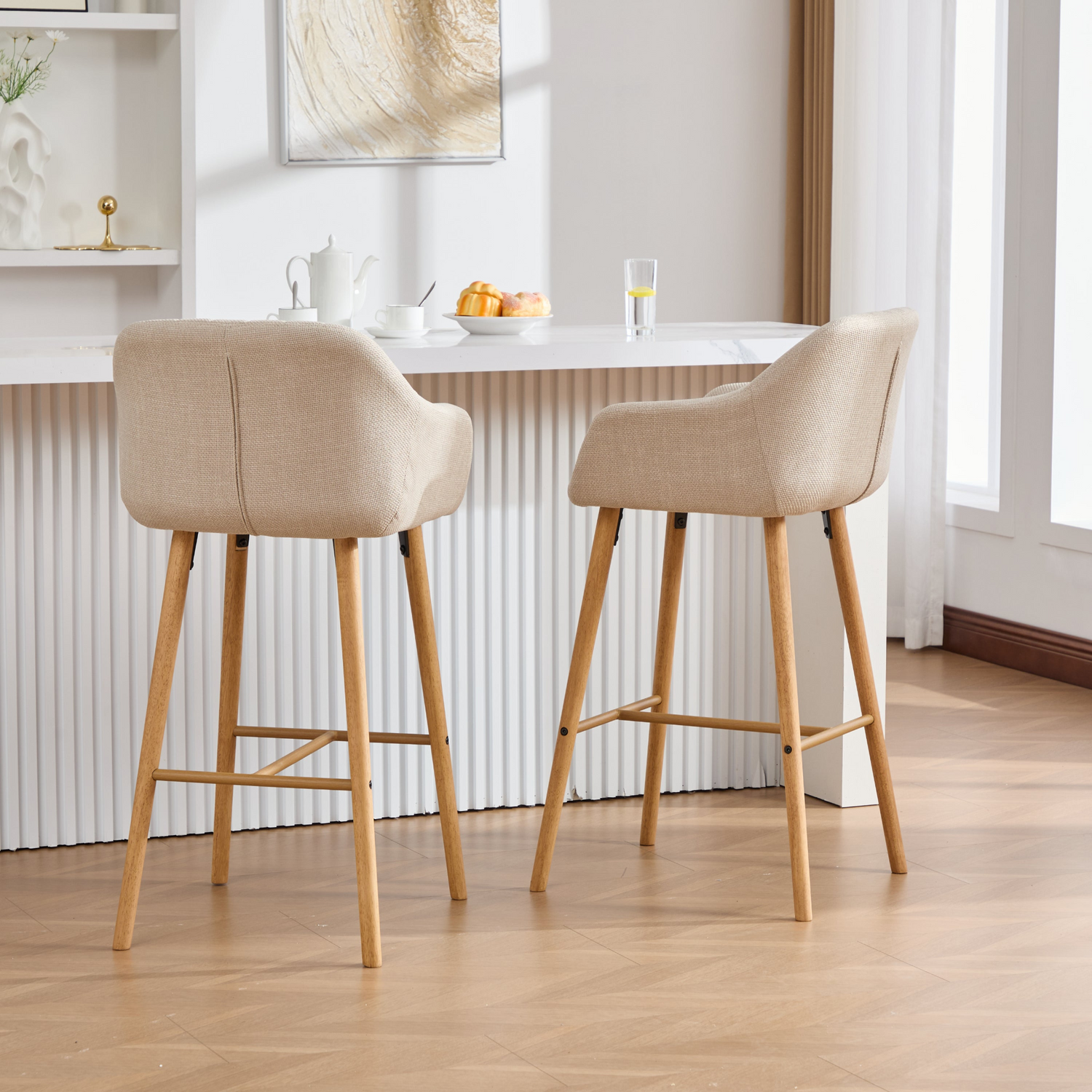 Modern linen upholstered bar stool with backrest, armrests, footrest, and solid wood legs from Start2Finish furniture.