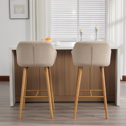 Modern linen upholstered bar stool with back, armrests, footrest, and solid wood legs, featuring a stylish and comfortable design.