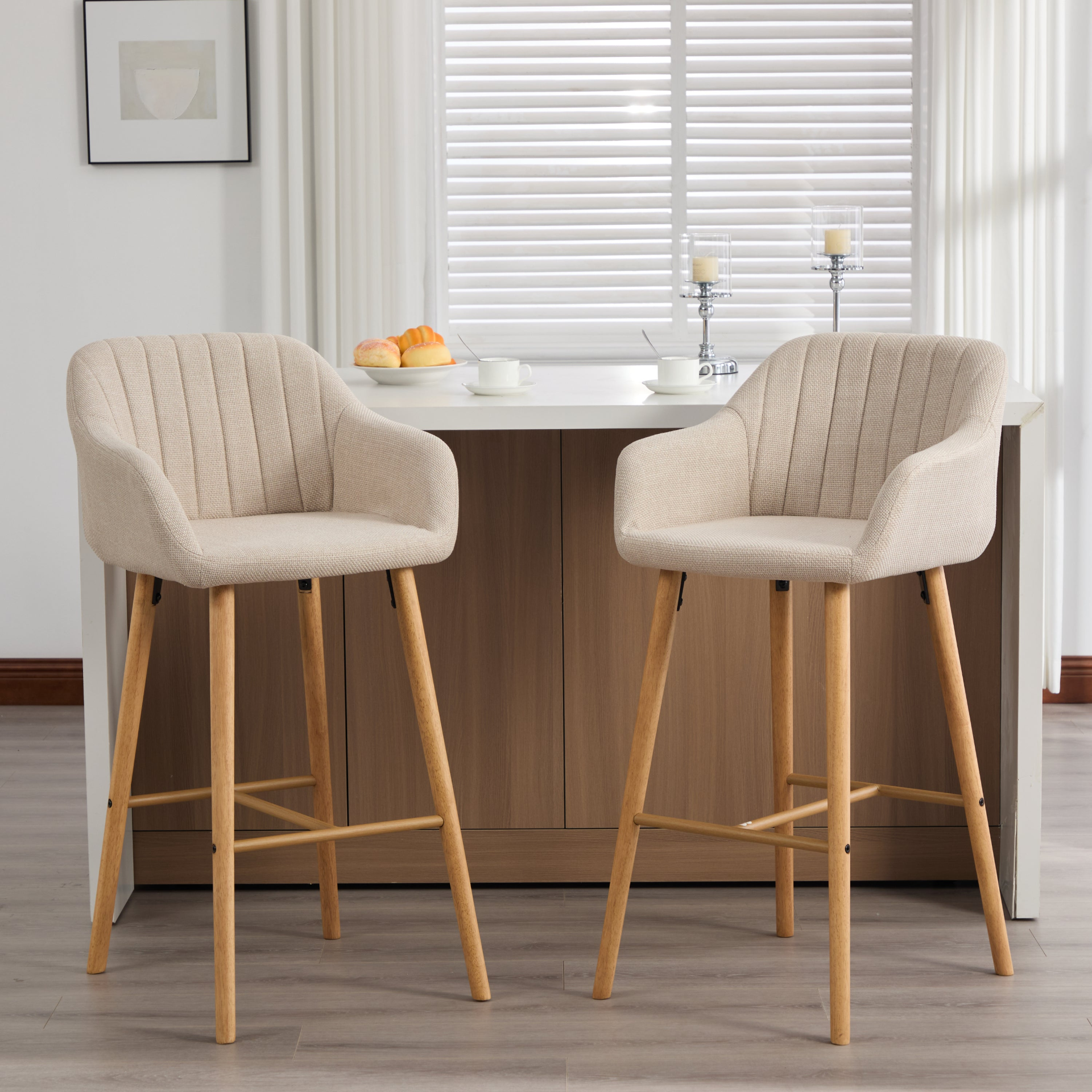 Modern linen upholstered bar stool with back, armrests, footrest, and solid wood legs from Start2Finish furniture.