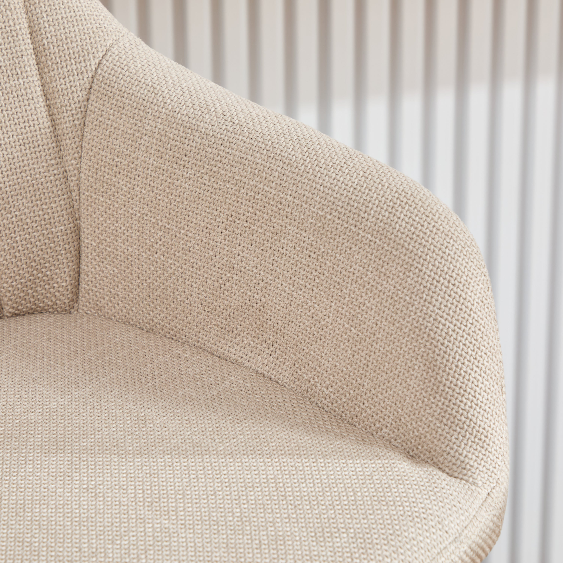 Modern linen upholstered bar stool with back, armrests, footrest, and solid wood legs from Start2Finish furniture.
