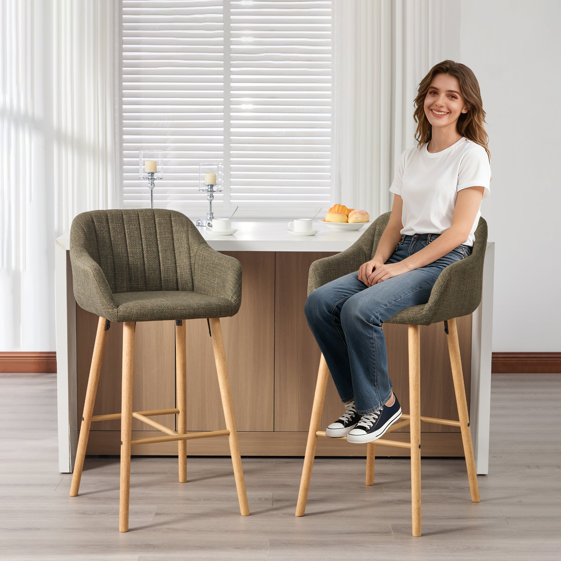 Modern linen upholstered bar stool with backrest, armrests, footrest, and solid wood legs, by Start2Finish.