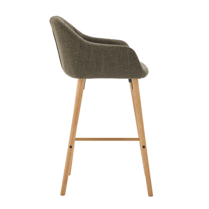 Modern linen upholstered bar stool with back, armrests, footrest, and solid wood legs, featuring sleek furniture design.