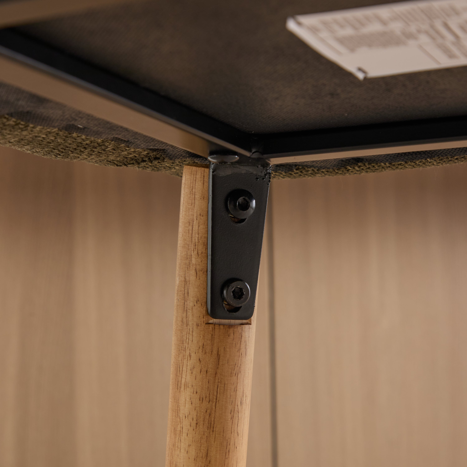 Modern linen upholstered bar stool with backrest, armrests, footrest, and solid wood legs, from Start2Finish furniture collection.