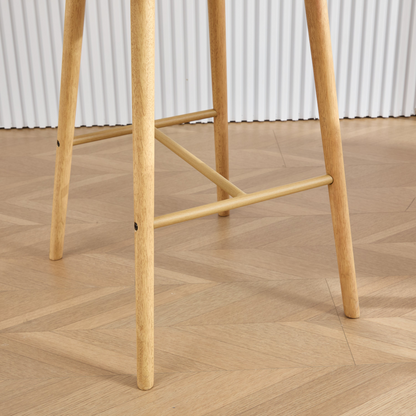Modern linen upholstered bar stool with back, armrests, footrest, and solid wood legs from Start2Finish furniture.