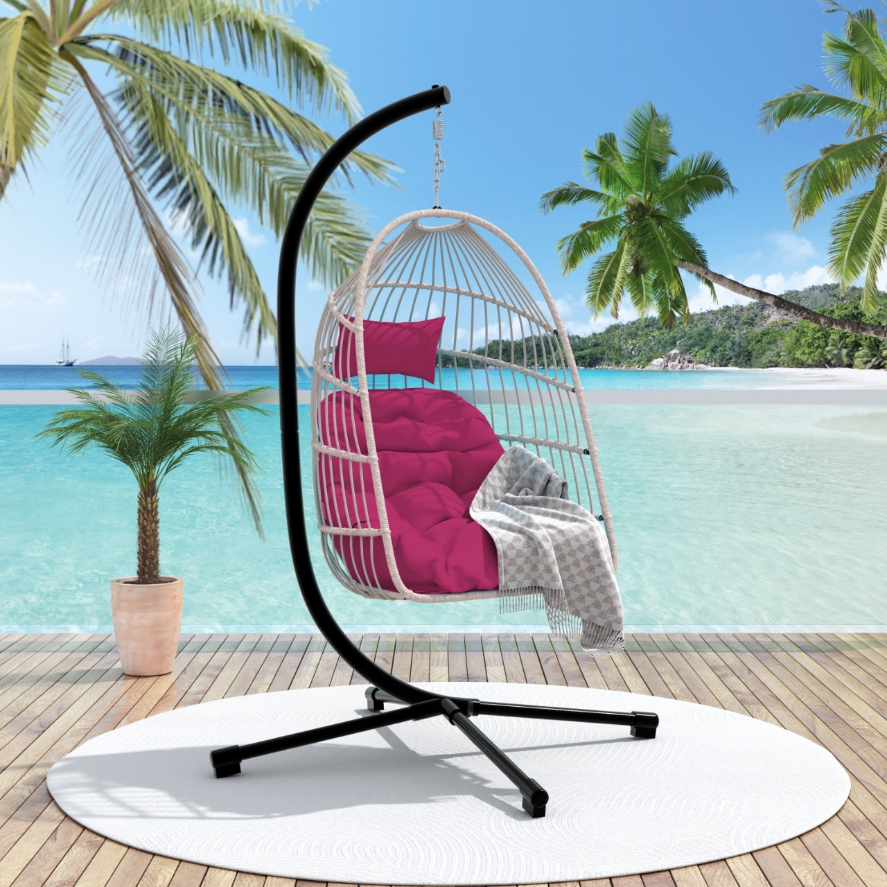 Outdoor hanging egg chair with stand, patio wicker rattan swing with cushion, by Start2Finish, for relaxing outdoor furniture.