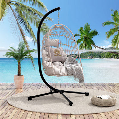 Outdoor hanging egg chair with stand, wicker rattan swing with cushion, perfect for patio relaxation and stylish outdoor furniture.