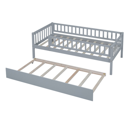 Wood daybed with trundle and fence guardrails from Start2Finish, shown in a cozy bedroom setting with bedding and pillows.