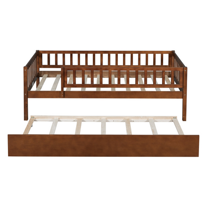 Wood daybed with trundle and fence guardrails by Start2Finish, shown in a home bedroom setting with bedding and pillows.