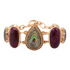 Purple turquoise and abalone gold statement bracelet with intricate jewelry design, featuring vibrant stones and elegant metalwork.
