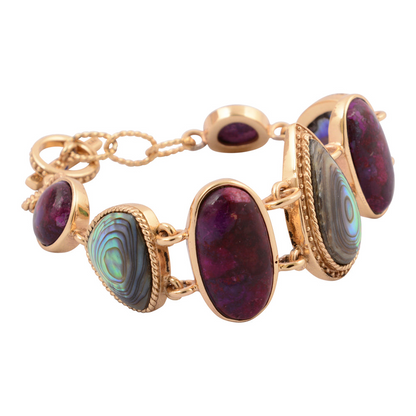 Purple turquoise and abalone gold statement bracelet with intricate jewelry design, featuring vibrant stones and a bold style.