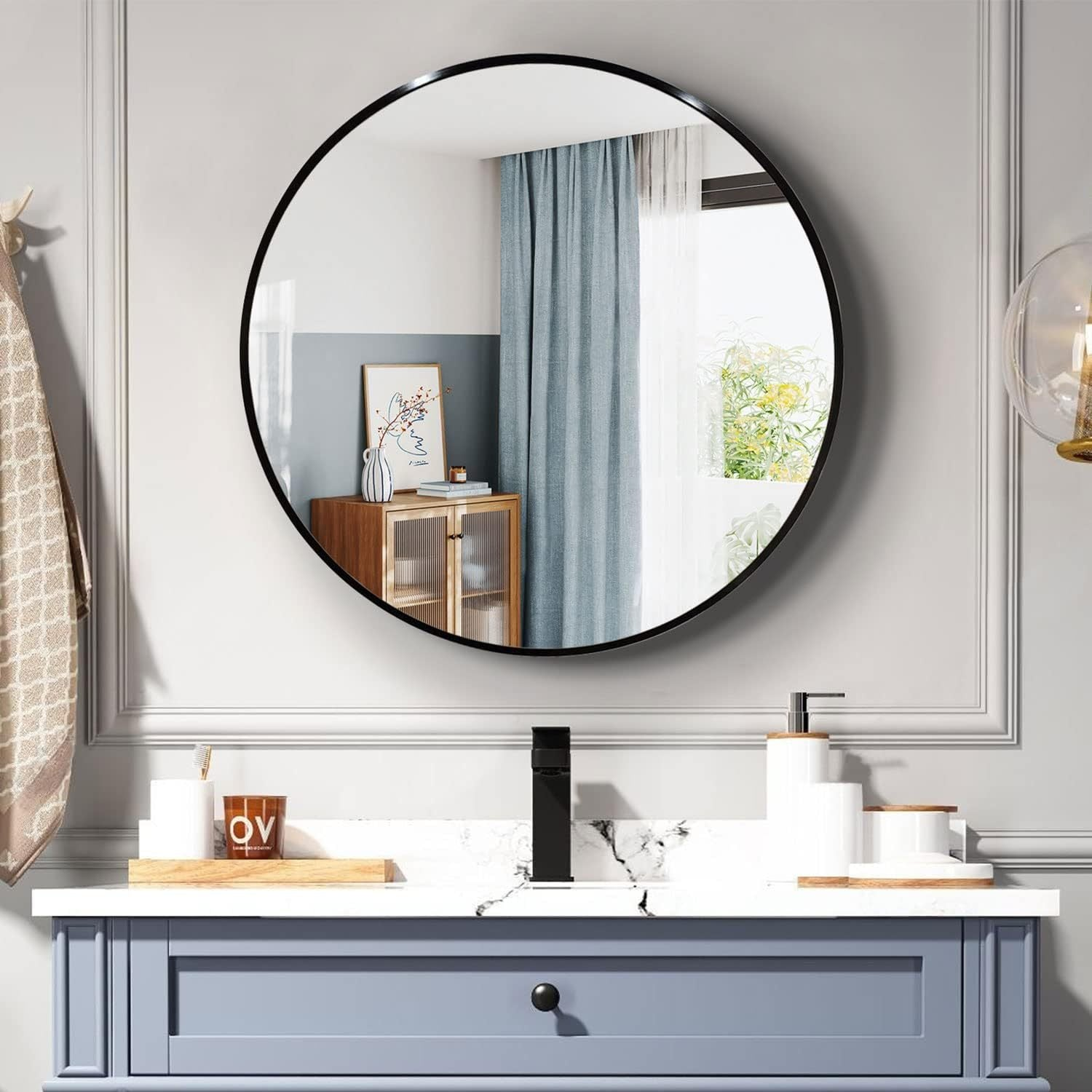 Start2Finish 36-inch round metal-framed wall-mounted bathroom mirror with sleek design for vanity or bathroom decor.