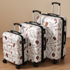 Three-piece hardshell luggage set by Start2Finish with spinner wheels and TSA locks, shown with all three suitcases stacked together.