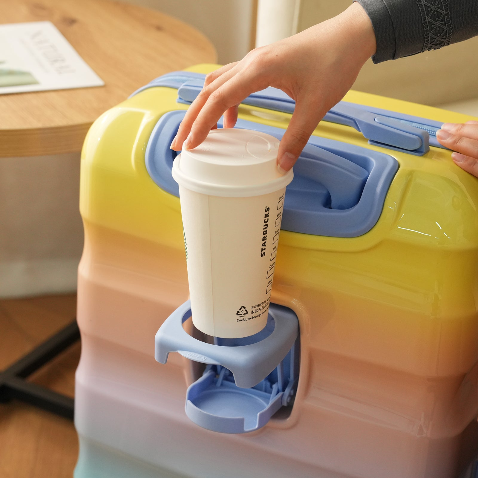 Start2Finish carry-on lightweight hardshell spinner luggage with TSA lock and built-in cup holder, designed for easy travel.