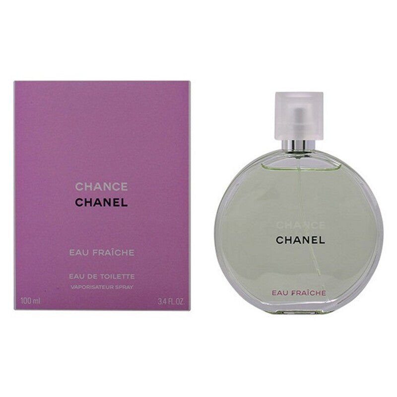 Woman holding a bottle of Chance Eau Fraiche Chanel EDT perfume, showcasing the elegant bodycare fragrance.
